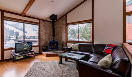 Family room with potbelly stove and a view of tahoe on Squaw Valley Rd. #6