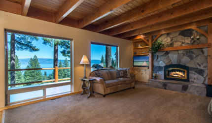 Sitting room with fireplace and view of lake tahoe on huckleberry lane