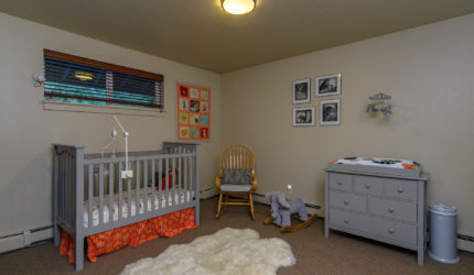 baby's room with carpeted floor